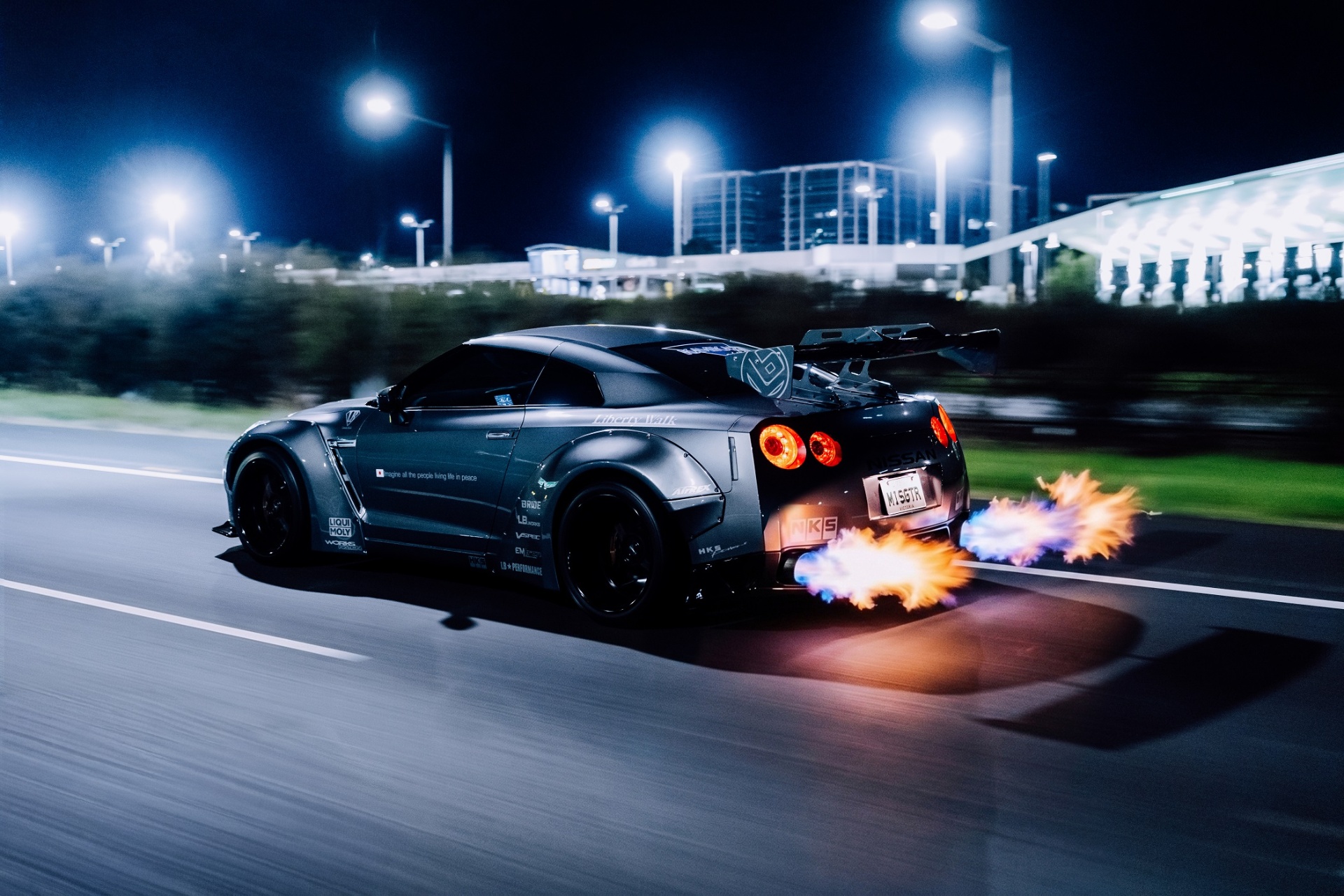 Liberty Walk Nissan R35 GT-R shooting flames at night